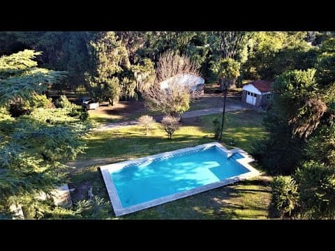7,500 m² lot on Route 9. House in need of renovation. Funes.