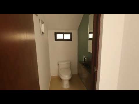 House for sale on a private street in Cholul with a double-height living room and dining room in Mérida, Yucatán.