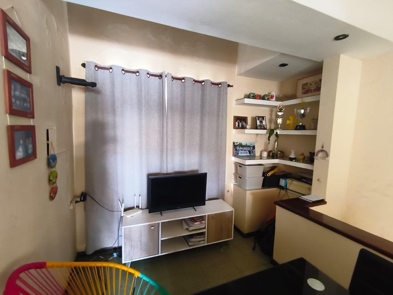 Two-bedroom house with a garage, patio, and barbecue area