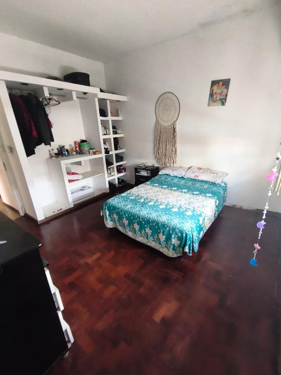 Two-bedroom house with a garage, patio, and barbecue area