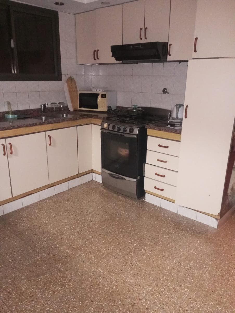 Two-bedroom house with a garage, patio, and barbecue area
