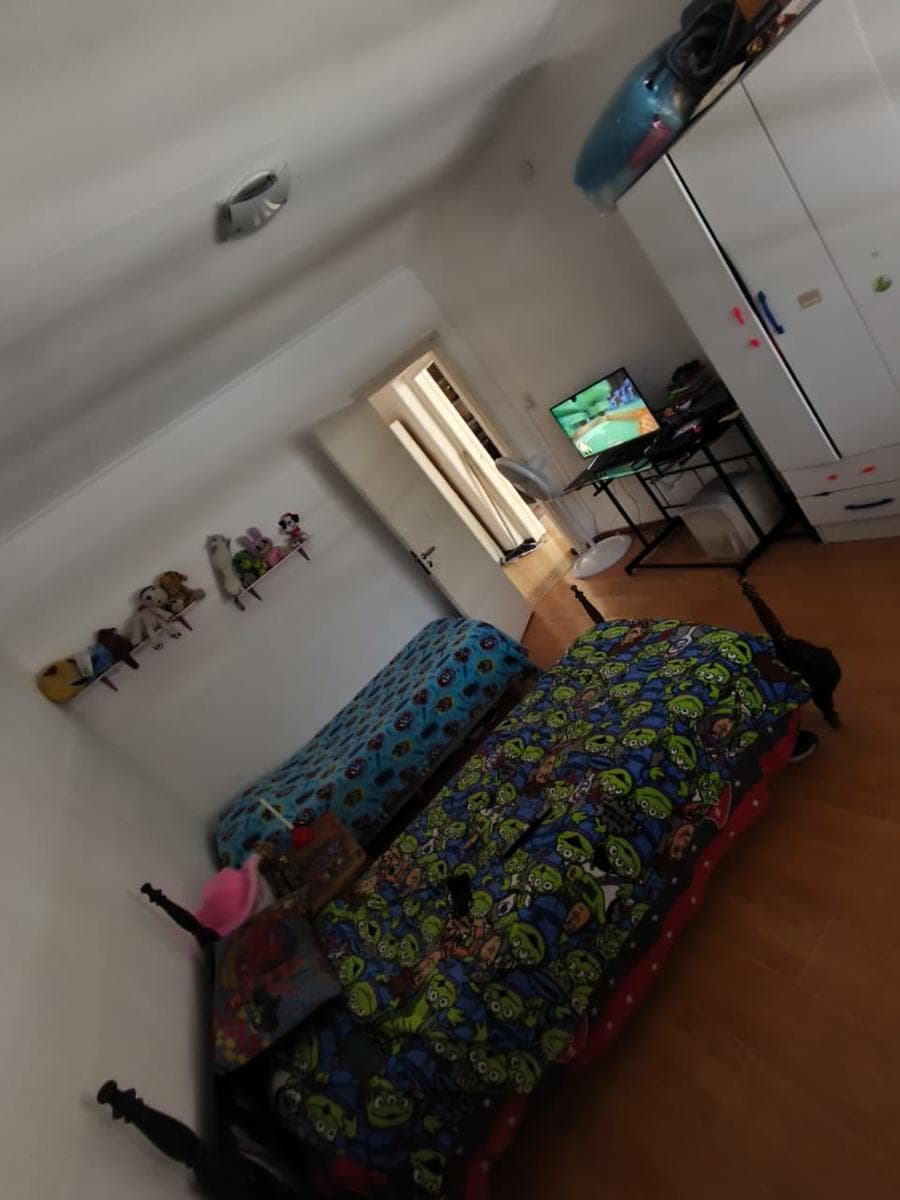 Two-bedroom house with a garage, patio, and barbecue area