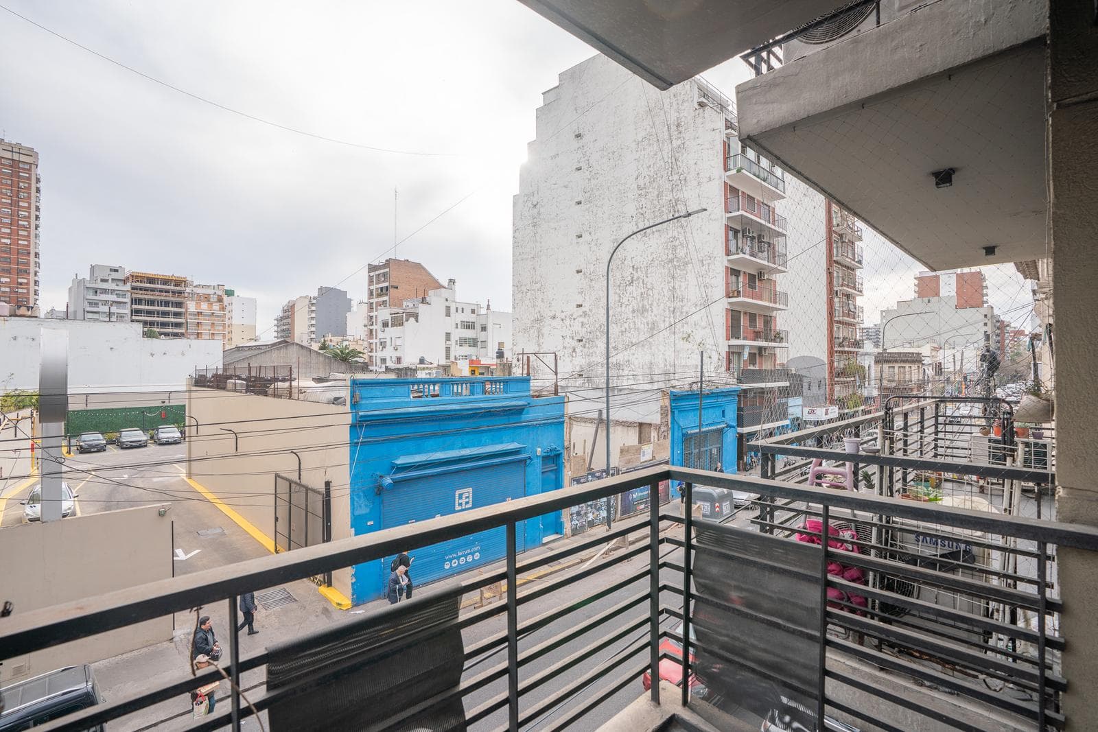 Modern studio apartment with a balcony facing the street
