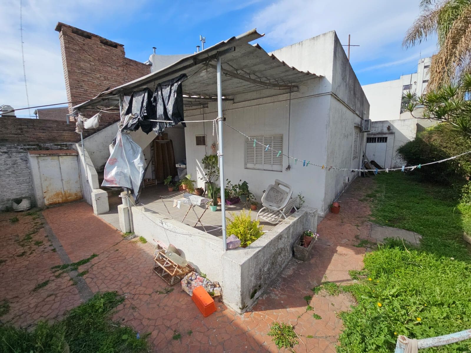 FOR SALE: TWO-BEDROOM HOUSE WITH GARAGE AND GREEN YARD WITH A POOL