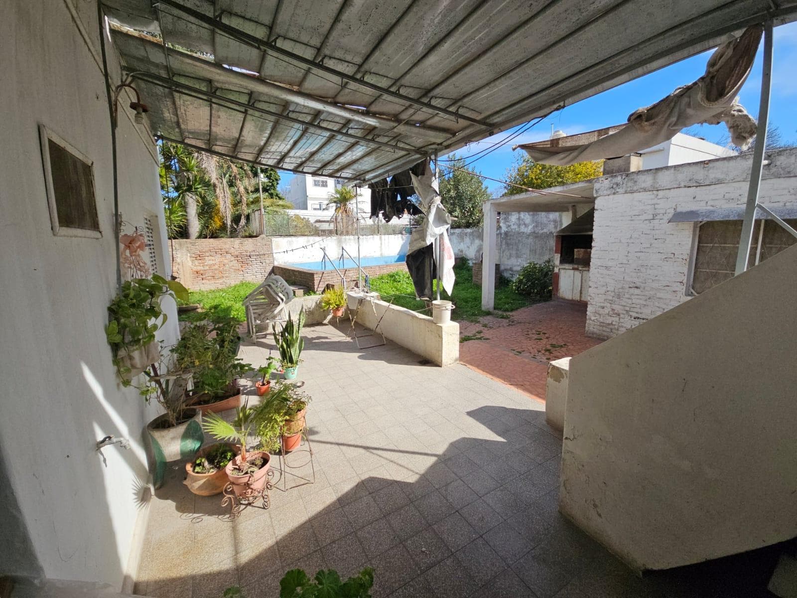 FOR SALE: TWO-BEDROOM HOUSE WITH GARAGE AND GREEN YARD WITH A POOL