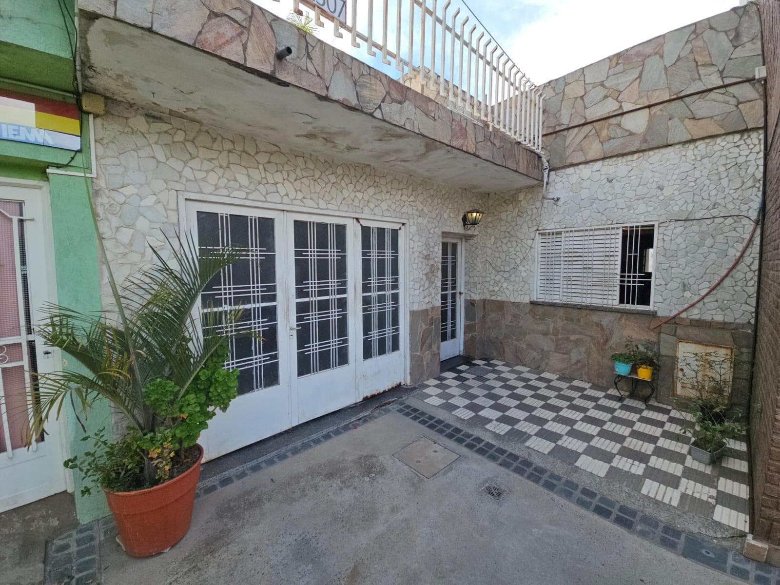 FOR SALE: TWO-BEDROOM HOUSE WITH GARAGE AND GREEN YARD WITH A POOL