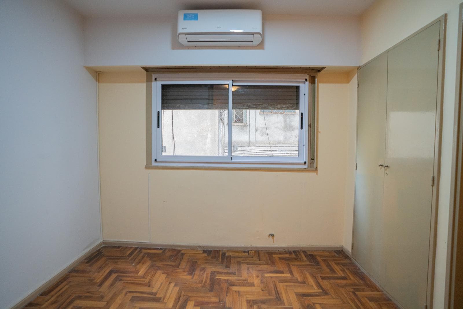 Interior studio apartment with a partition and a separate kitchen
