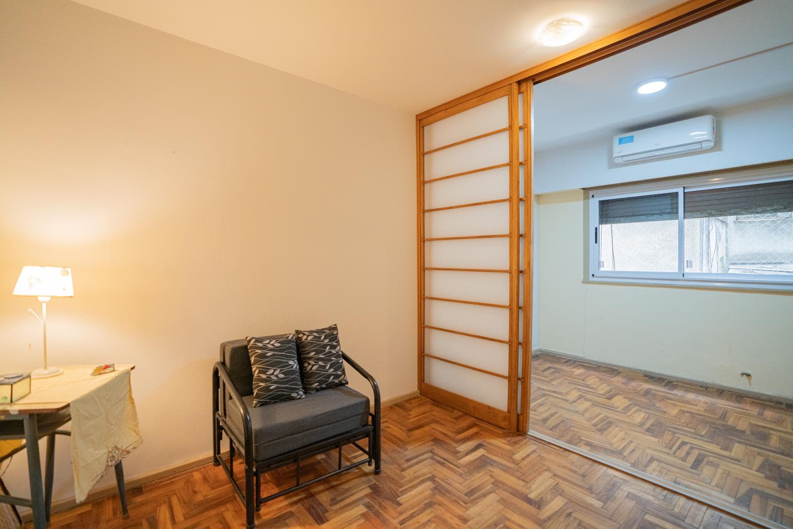 Interior studio apartment with a partition and a separate kitchen