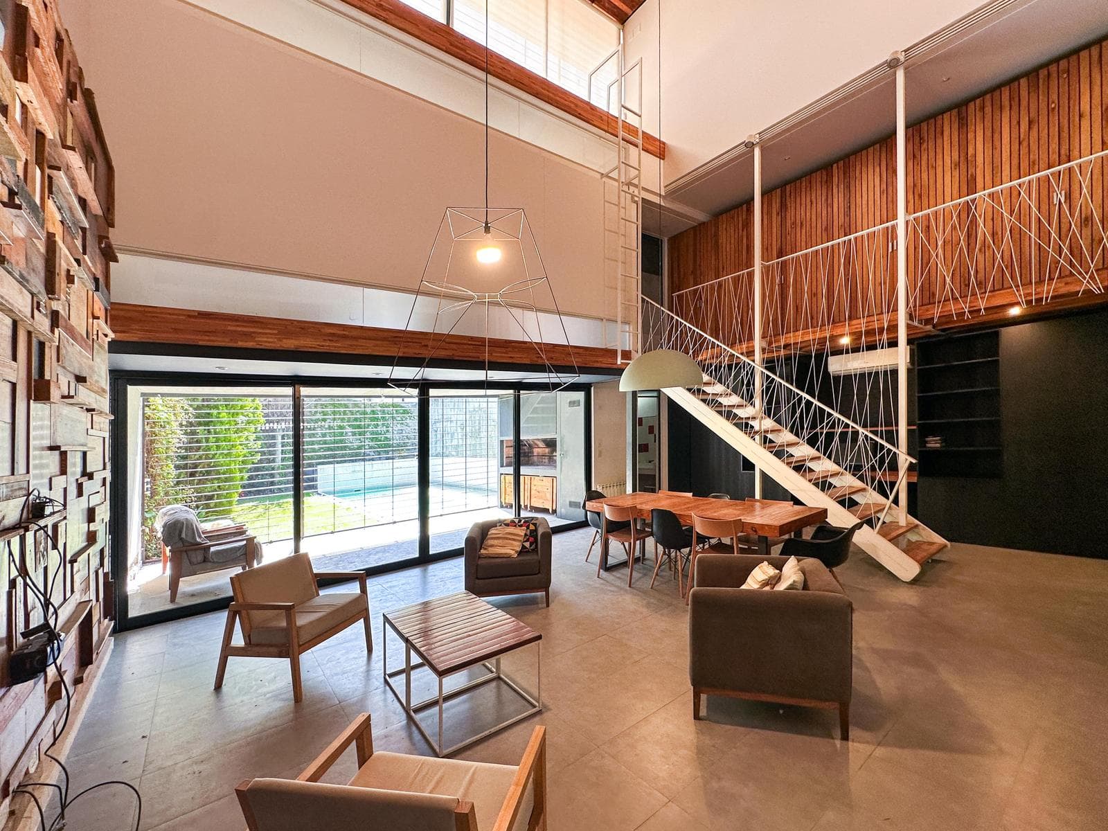 Designer home with 3 bedrooms, 2 garage spaces, a garden, and a pool