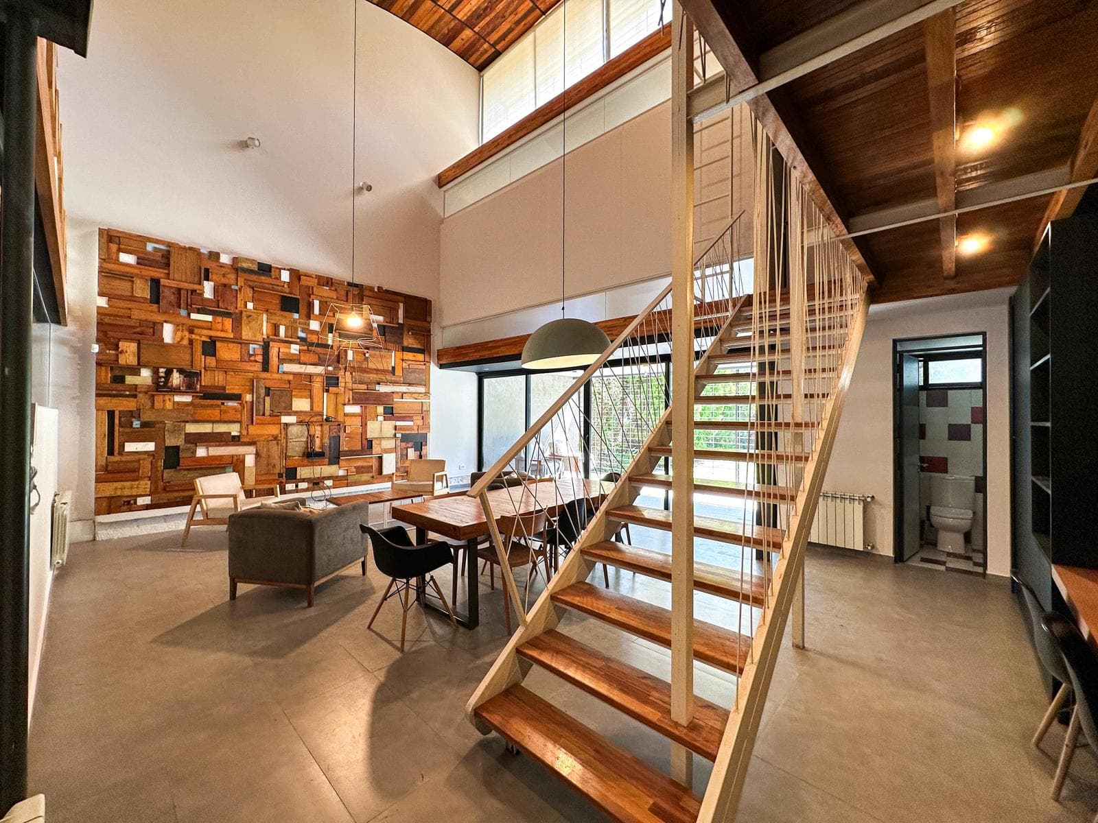 Designer home with 3 bedrooms, 2 garage spaces, a garden, and a pool