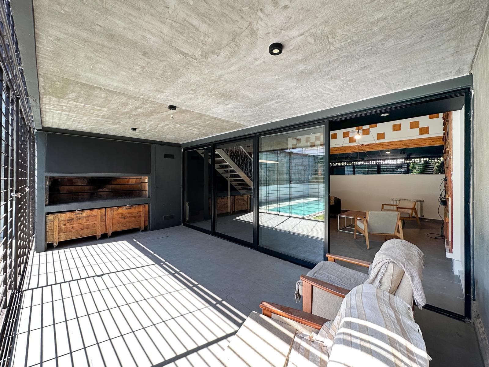 Designer home with 3 bedrooms, 2 garage spaces, a garden, and a pool