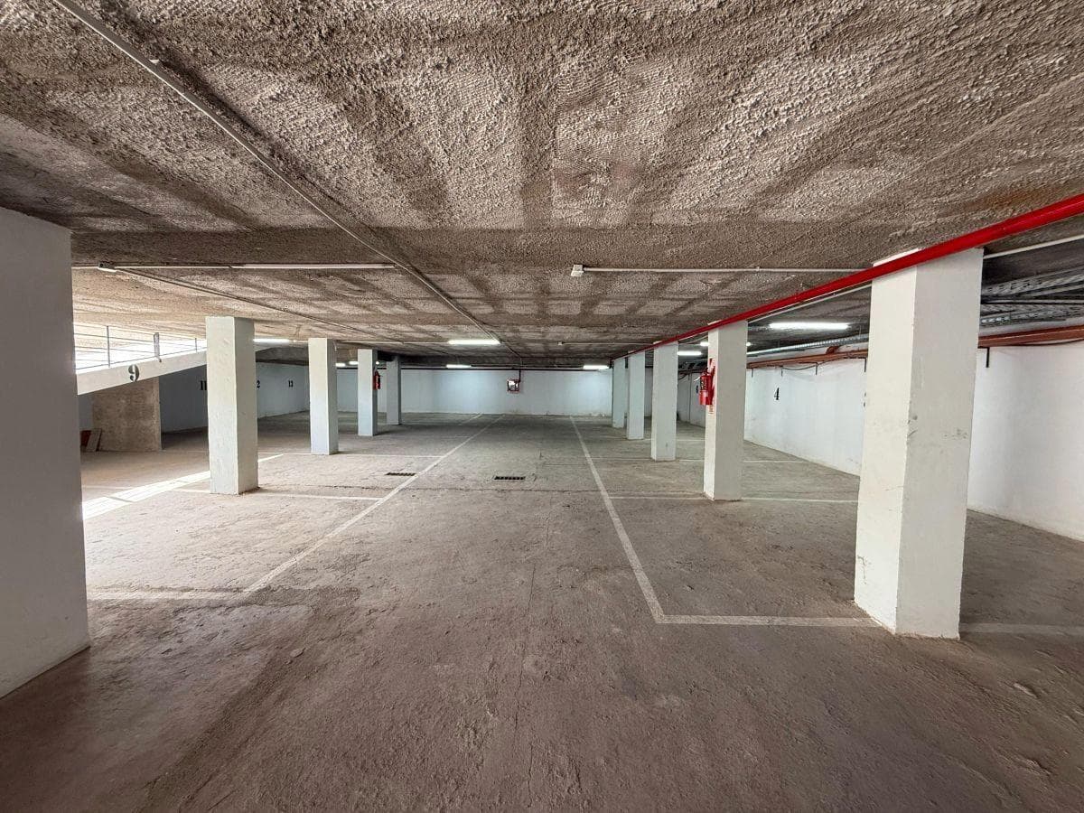 Covered parking garage on Av. Rogelio Nores Martínez — Barrio Jardín