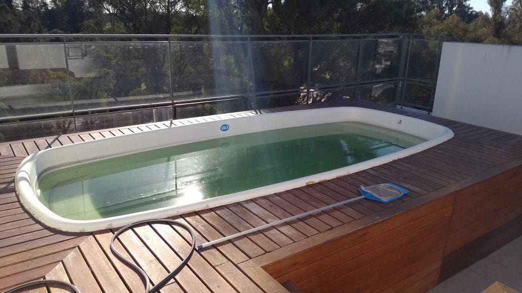 Across from the park, there is a terrace with a pool and a grill.