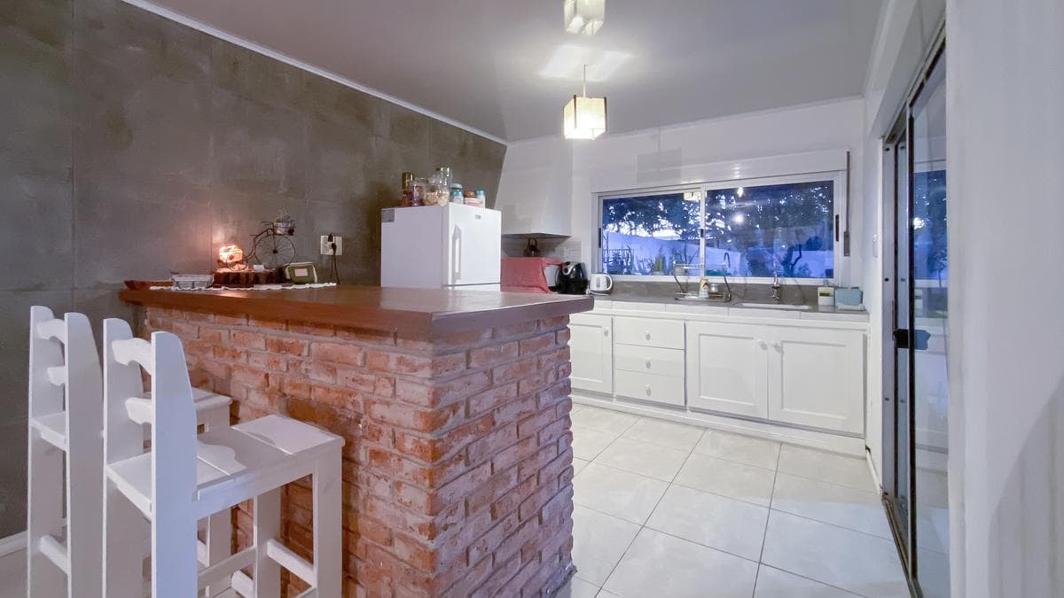 Two-bedroom house for sale with a spacious patio in San Carlos, Maldonado.