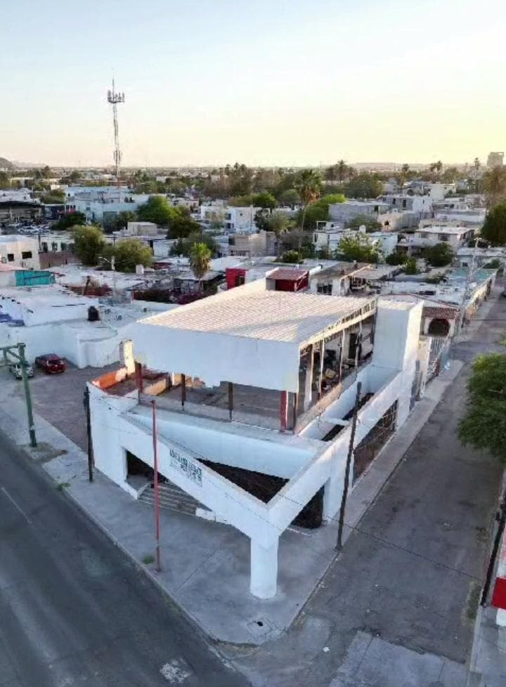 Land with a building in need of renovation for sale