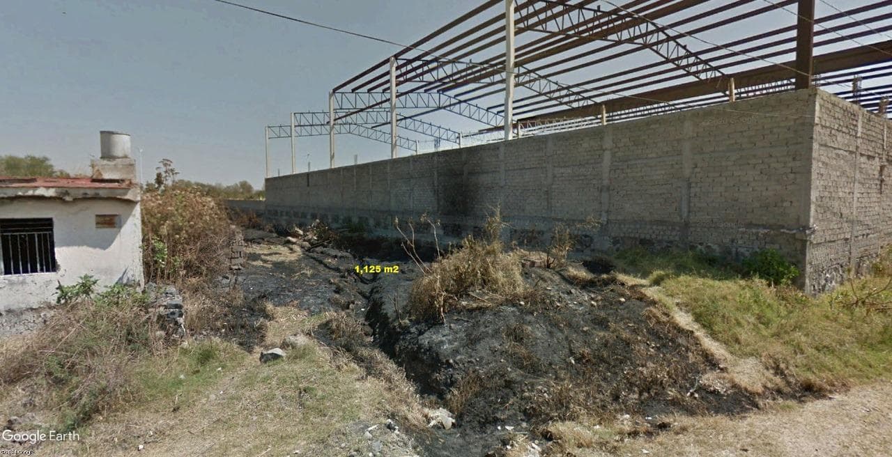 Land in Nuevo Periferico Oriente, near the airport.