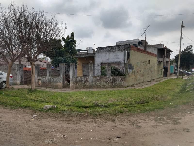 Spacious corner lot for sale with a garage and yard.