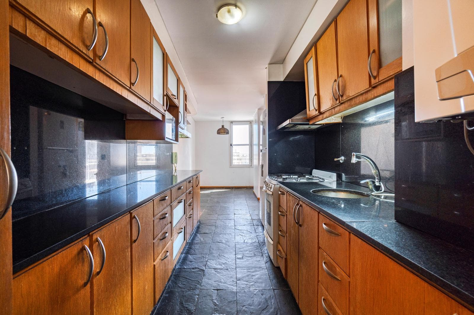 FOR SALE—2-bedroom duplex with a versatile room, private terrace, garage, and amenities. QUALIFIES FOR A LOAN