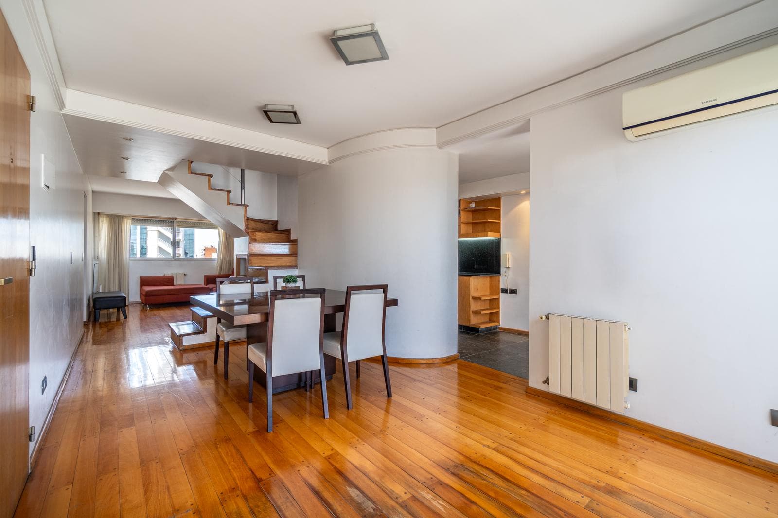 FOR SALE—2-bedroom duplex with a versatile room, private terrace, garage, and amenities. QUALIFIES FOR A LOAN