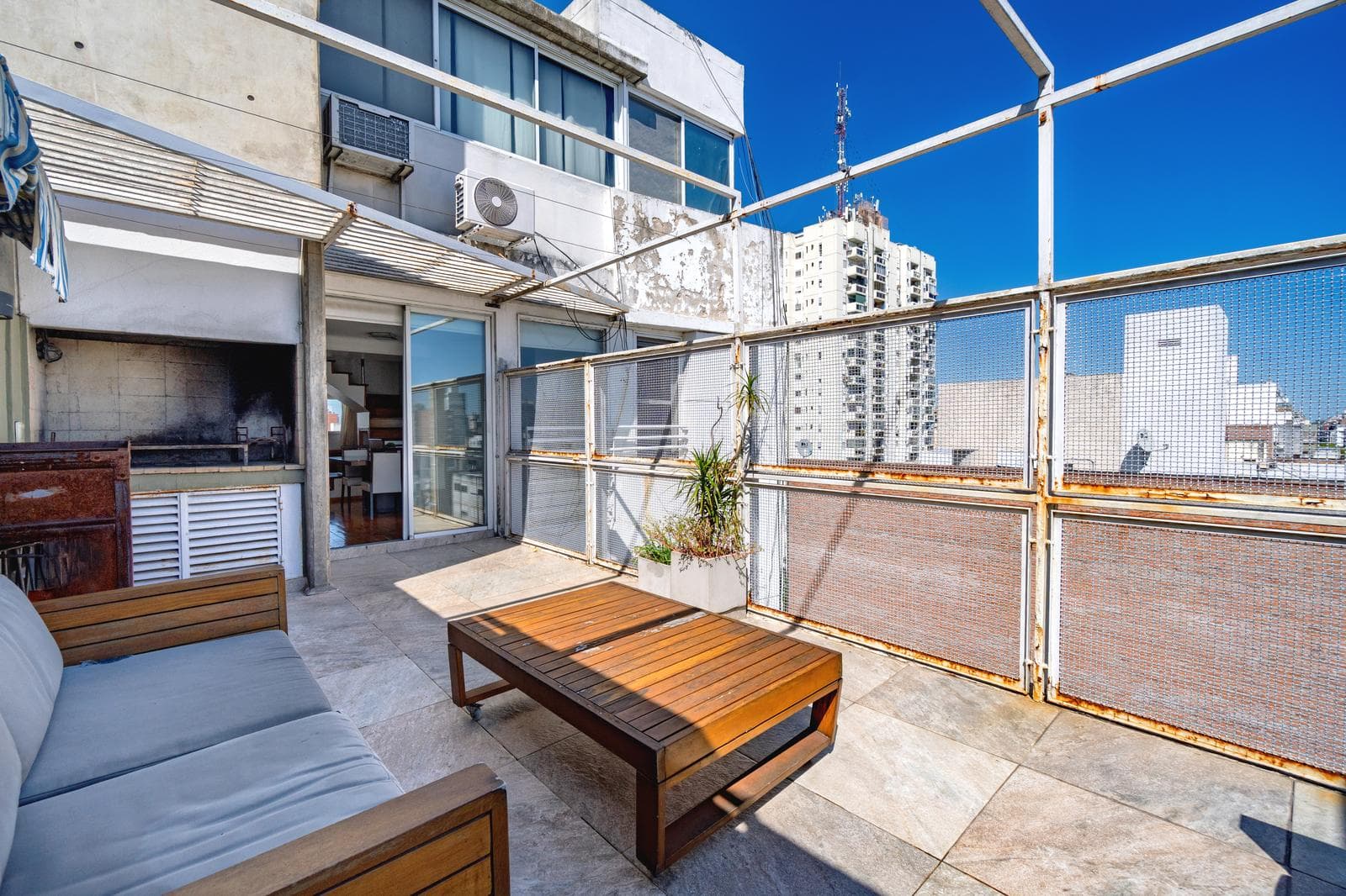 FOR SALE—2-bedroom duplex with a versatile room, private terrace, garage, and amenities. QUALIFIES FOR A LOAN