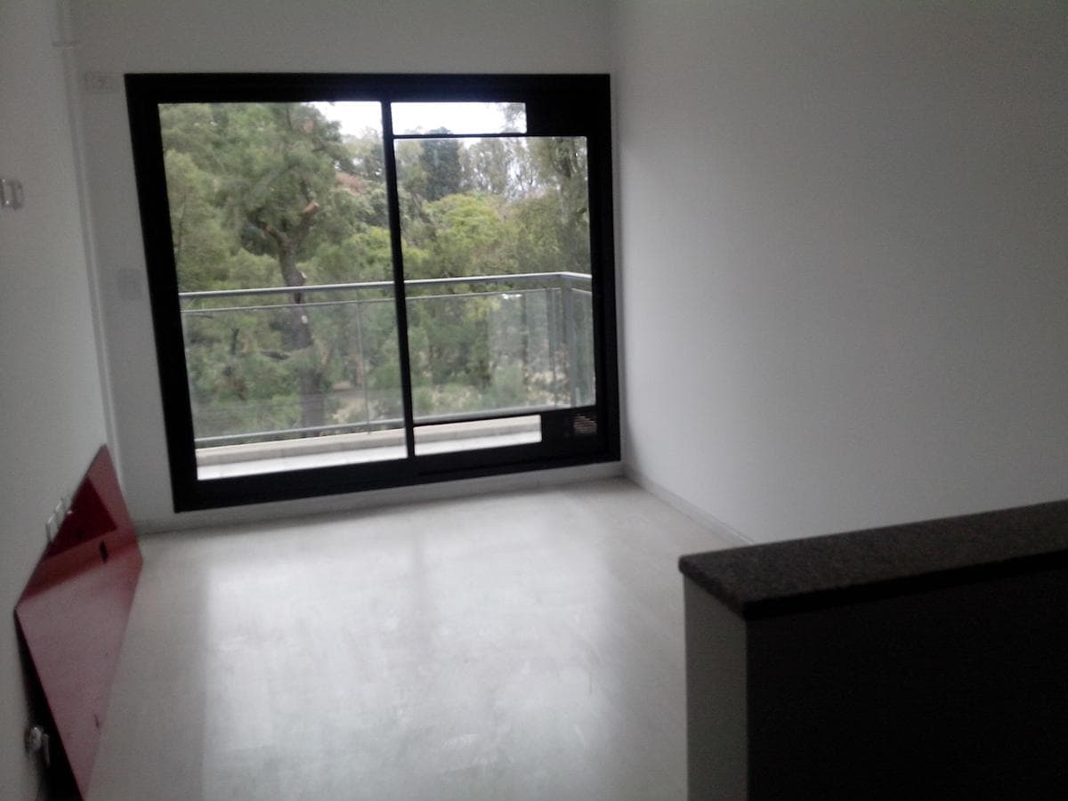 Across from the park, there is a terrace with a pool and a grill.