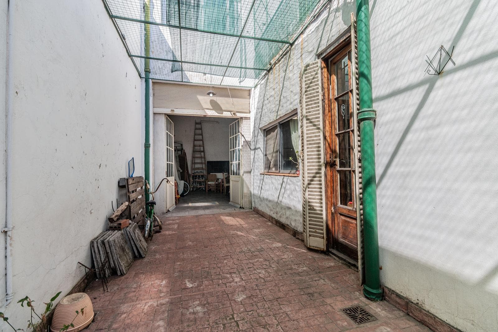 House with an apartment, plus a large storage room and parking spaces on its own lot. Excellent neighborhood!!
