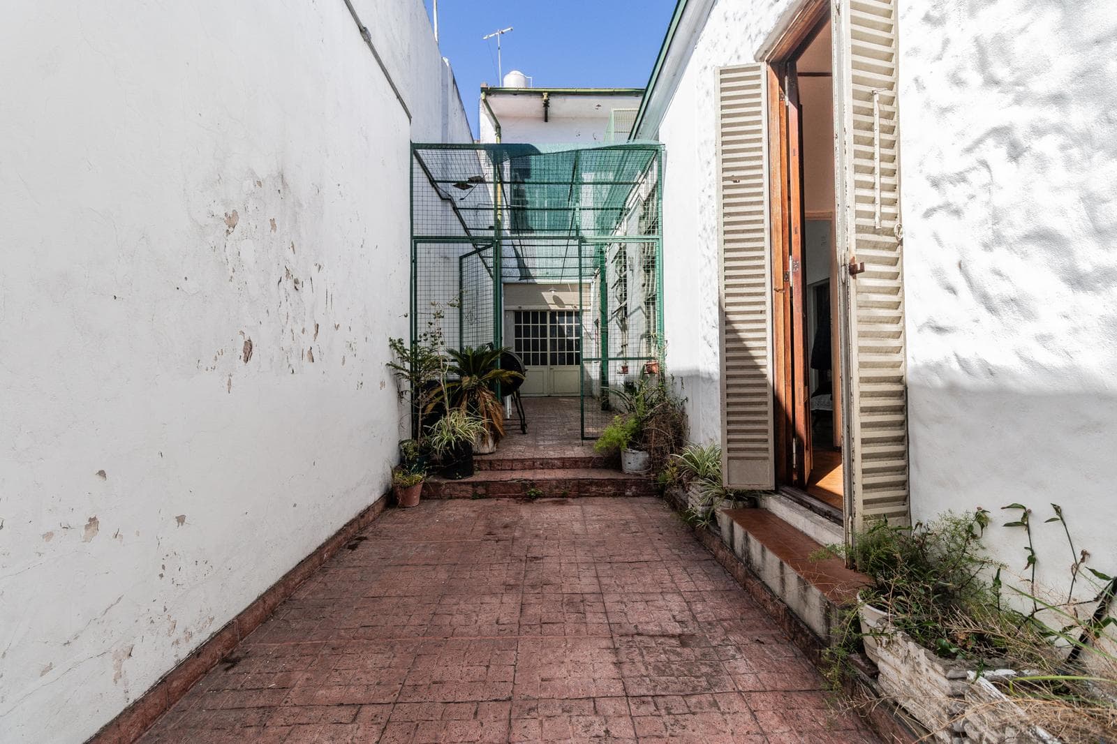 House with an apartment, plus a large storage room and parking spaces on its own lot. Excellent neighborhood!!