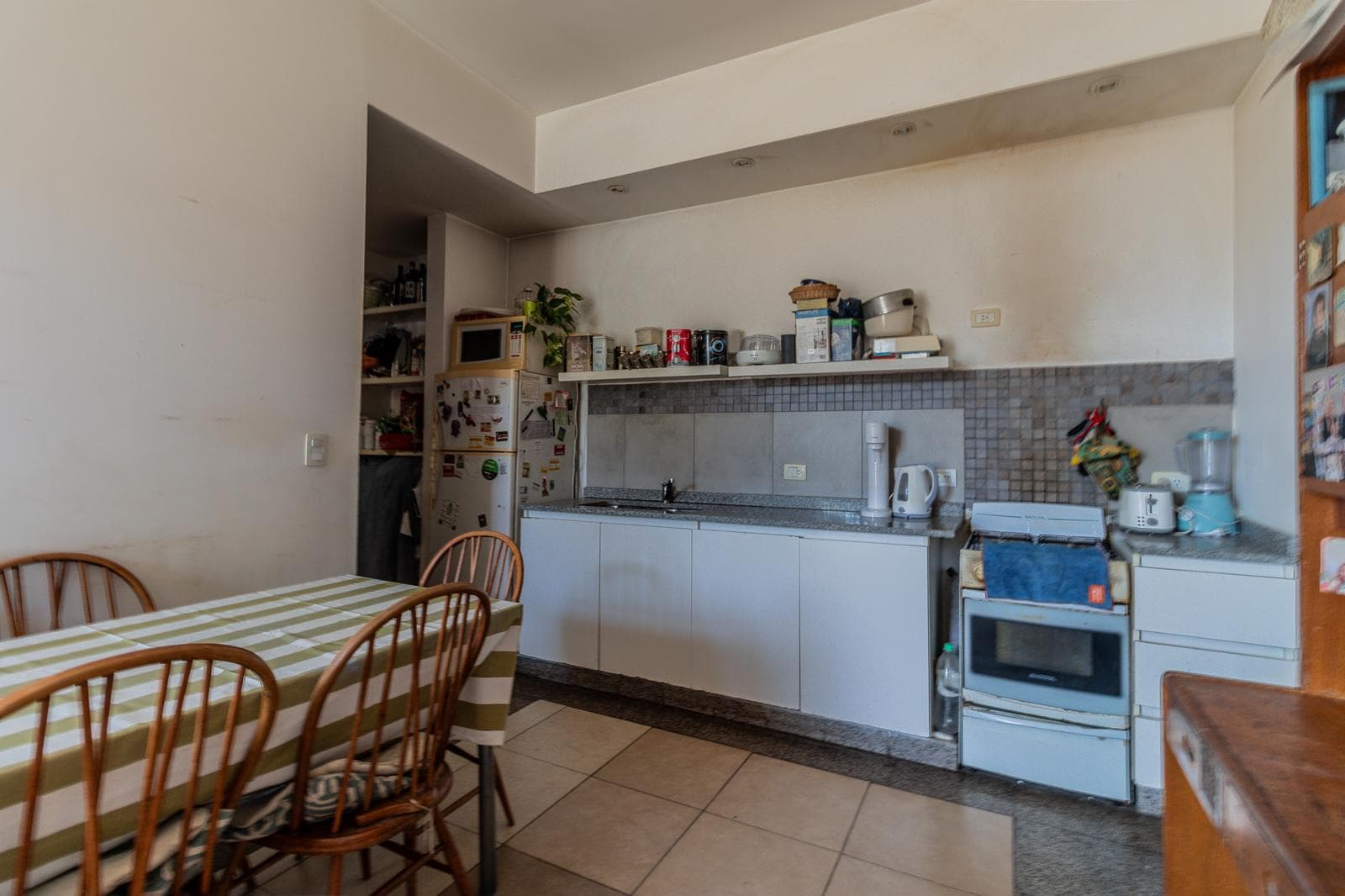 House with an apartment, plus a large storage room and parking spaces on its own lot. Excellent neighborhood!!