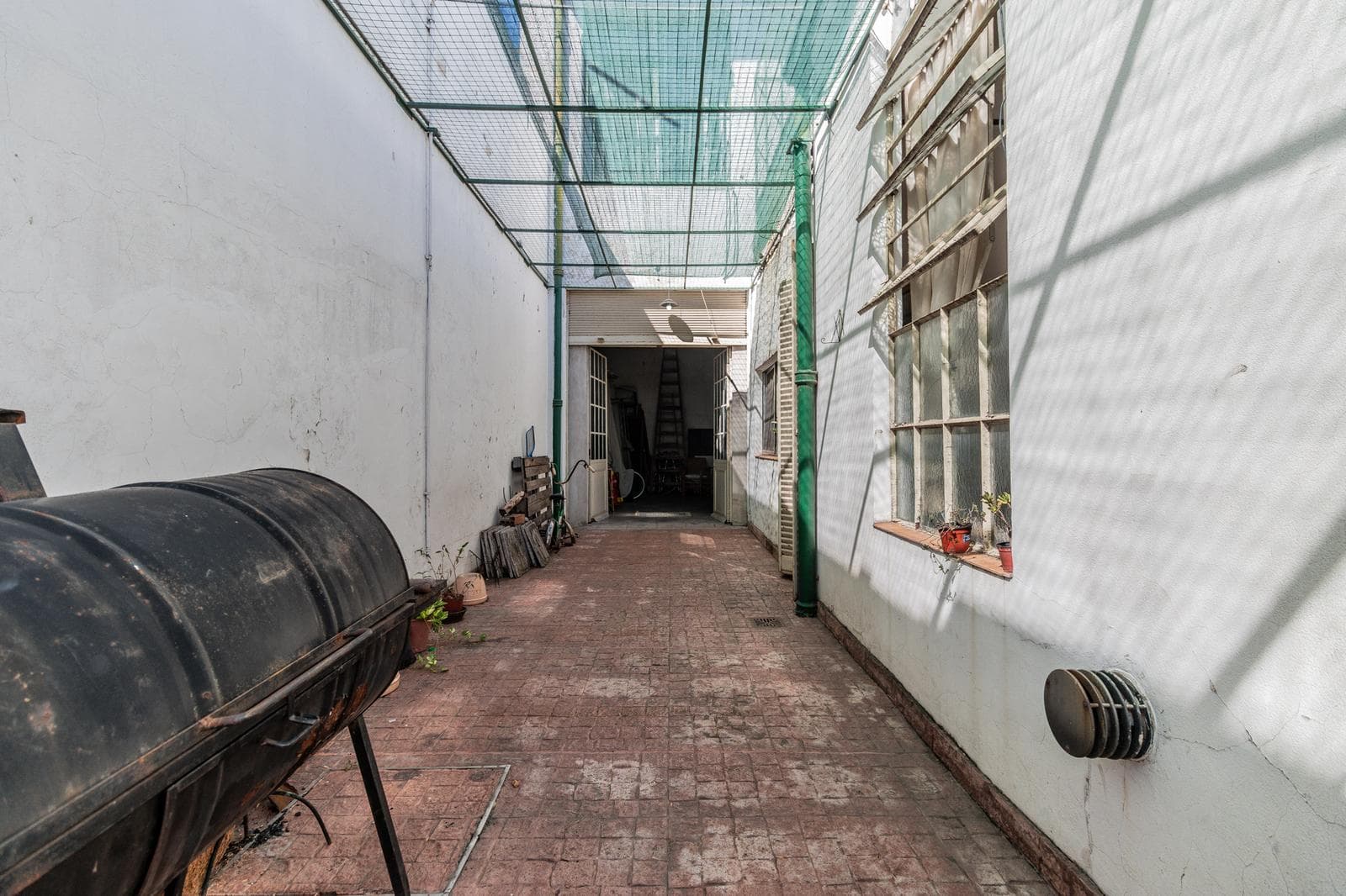 House with an apartment, plus a large storage room and parking spaces on its own lot. Excellent neighborhood!!