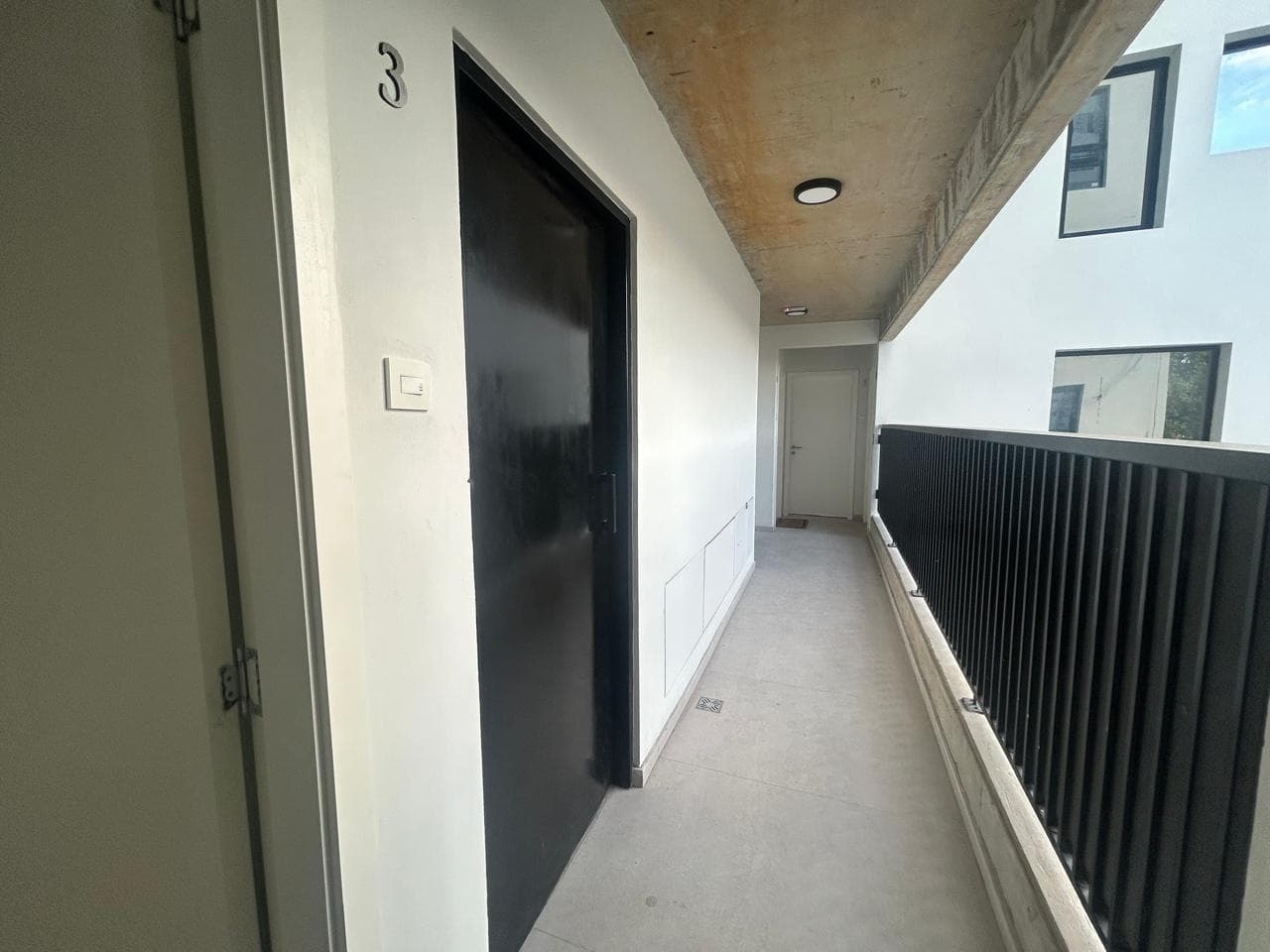 Large studio apartment with a front-facing balcony