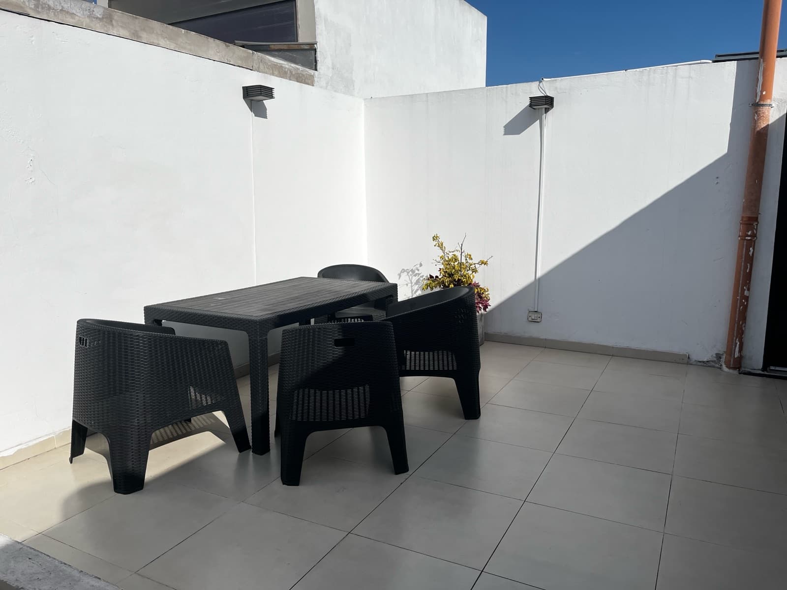 Modern studio apartment with a large patio