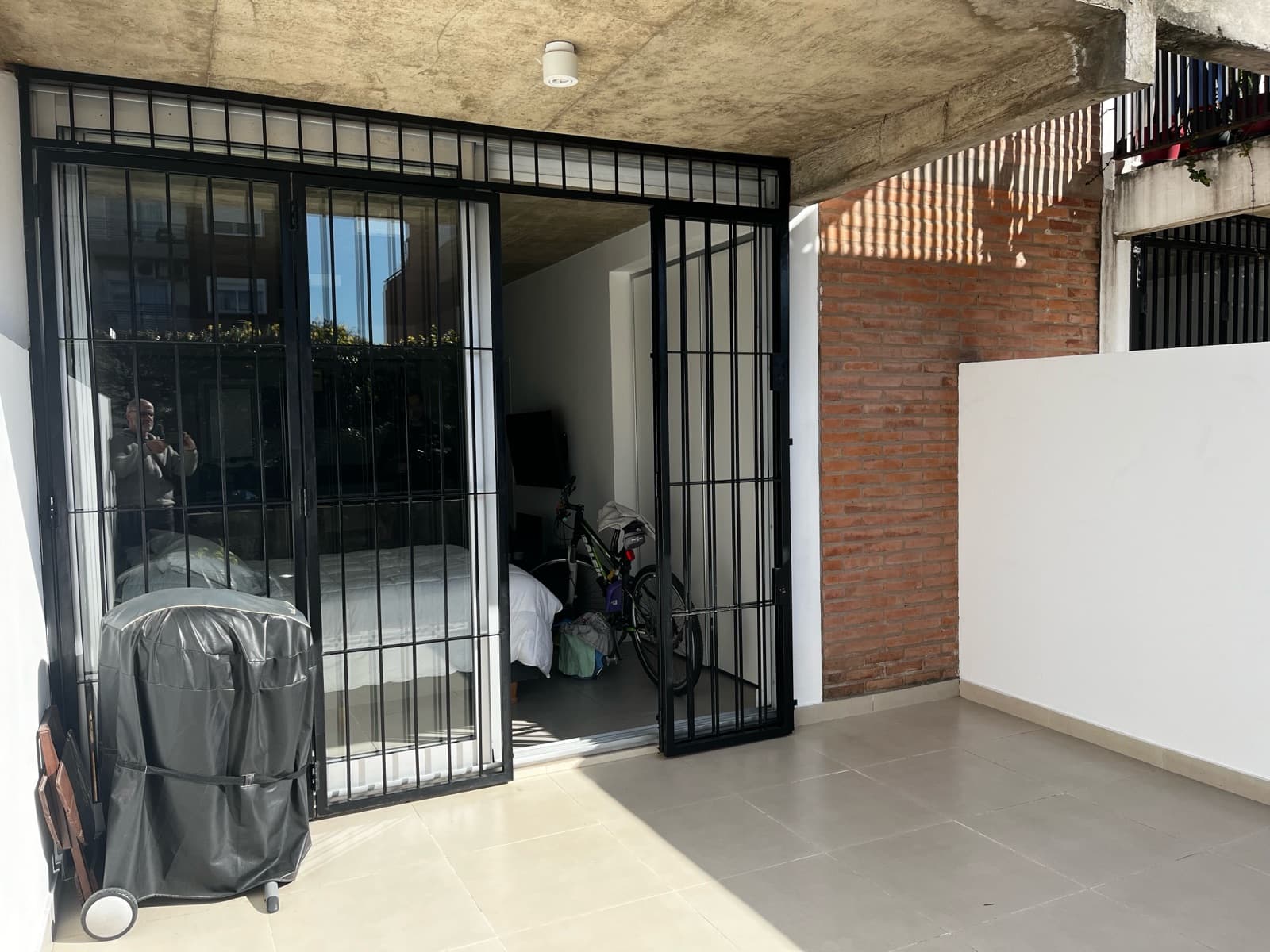 Modern studio apartment with a large patio