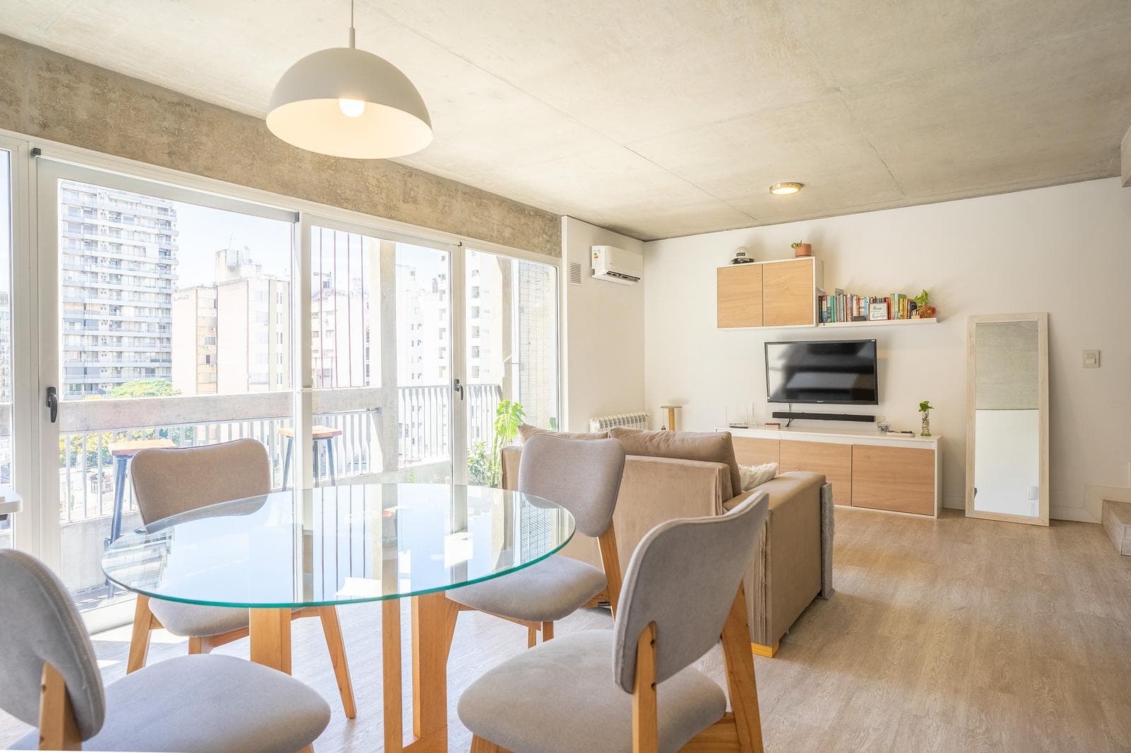 Two-bedroom duplex apartment for sale with a private terrace and garage in the riverfront area; financing available