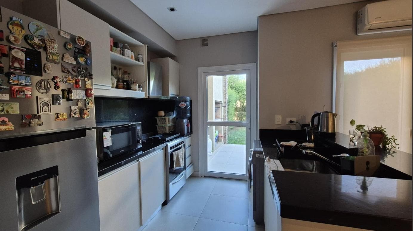 Duplex for sale with a garden in the El Palmar gated community, Nordelta. With a pool.