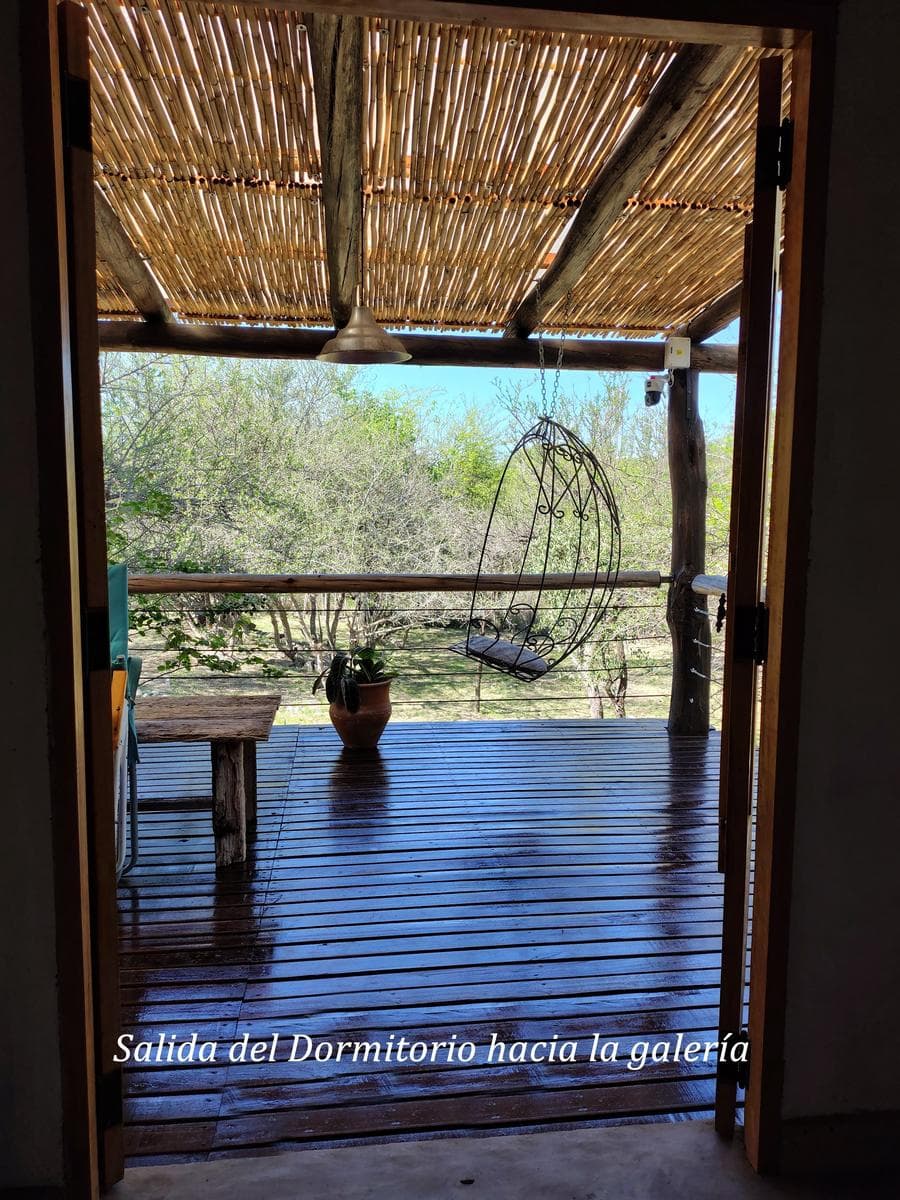 Adobe house in a natural setting, with a spacious porch overlooking the park | Camino al Dique | Villa de Las Rosas