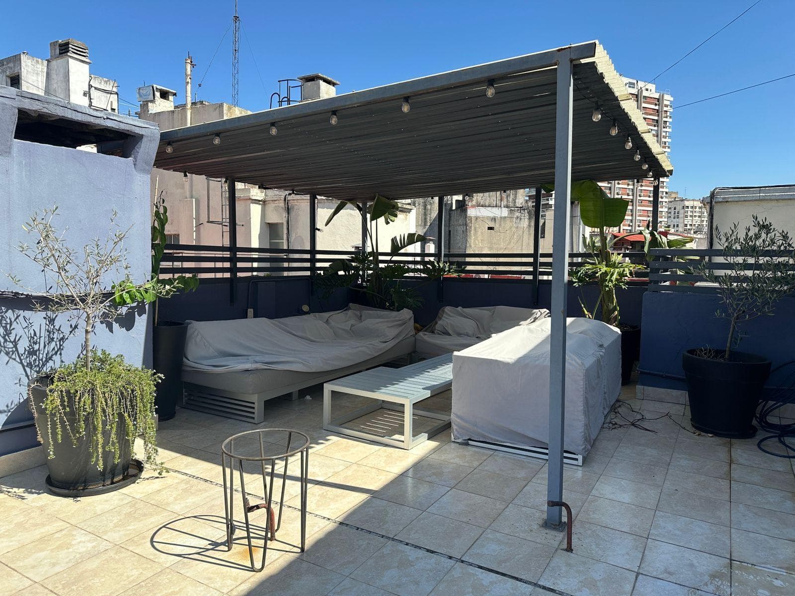 Luxury 5-room apartment for sale, with a terrace and a sun-filled multipurpose room, plants, and a grill on Quintana Avenue