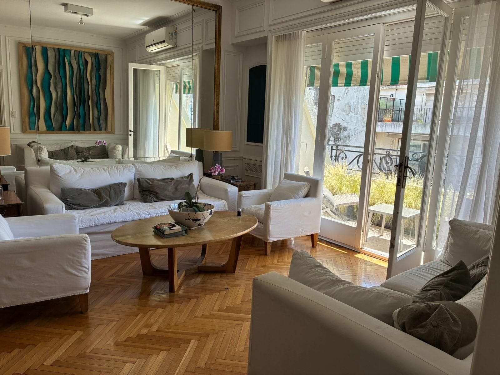 Luxury 5-room apartment for sale, with a terrace and a sun-filled multipurpose room, plants, and a grill on Quintana Avenue