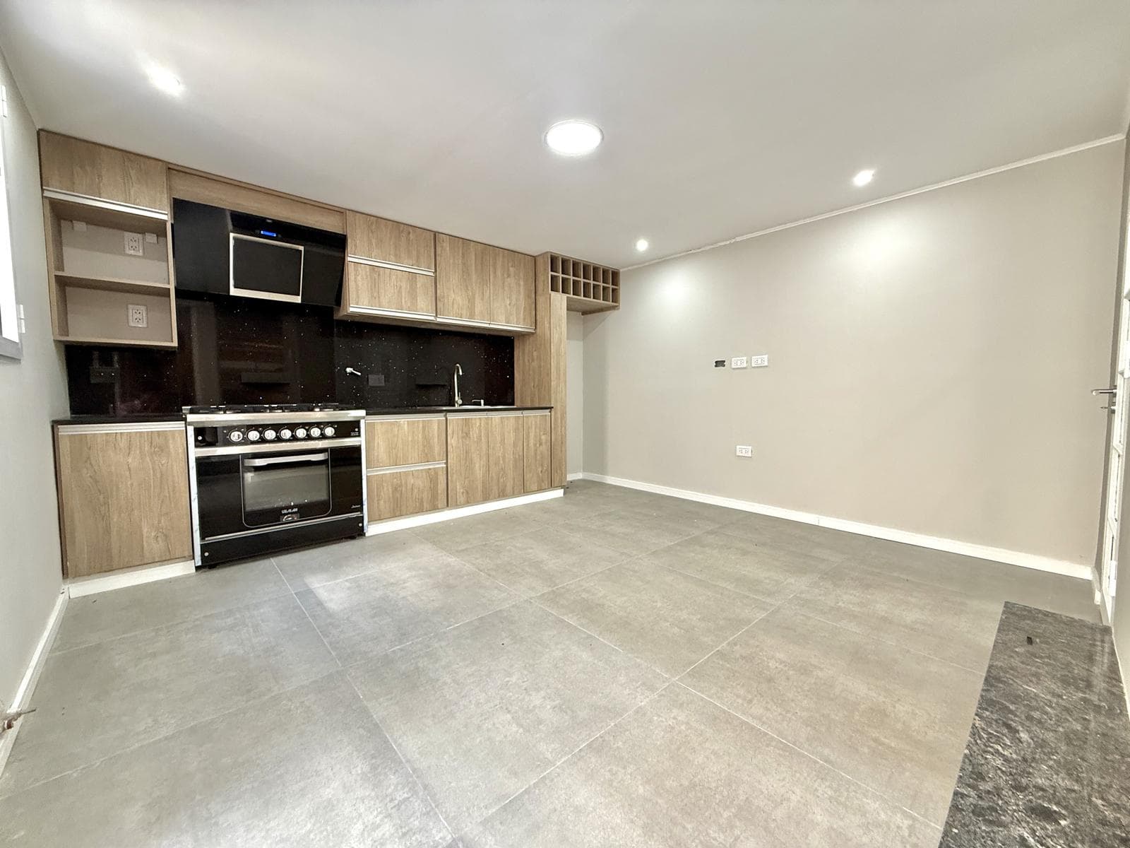 2-bedroom house on the street with a garage