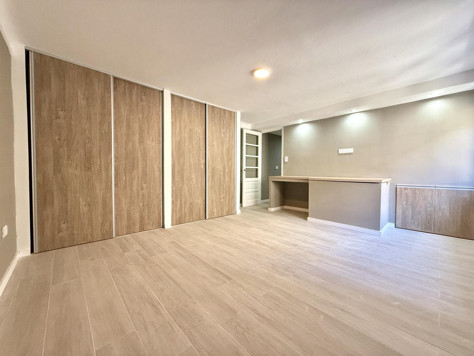 2-bedroom house on the street with a garage
