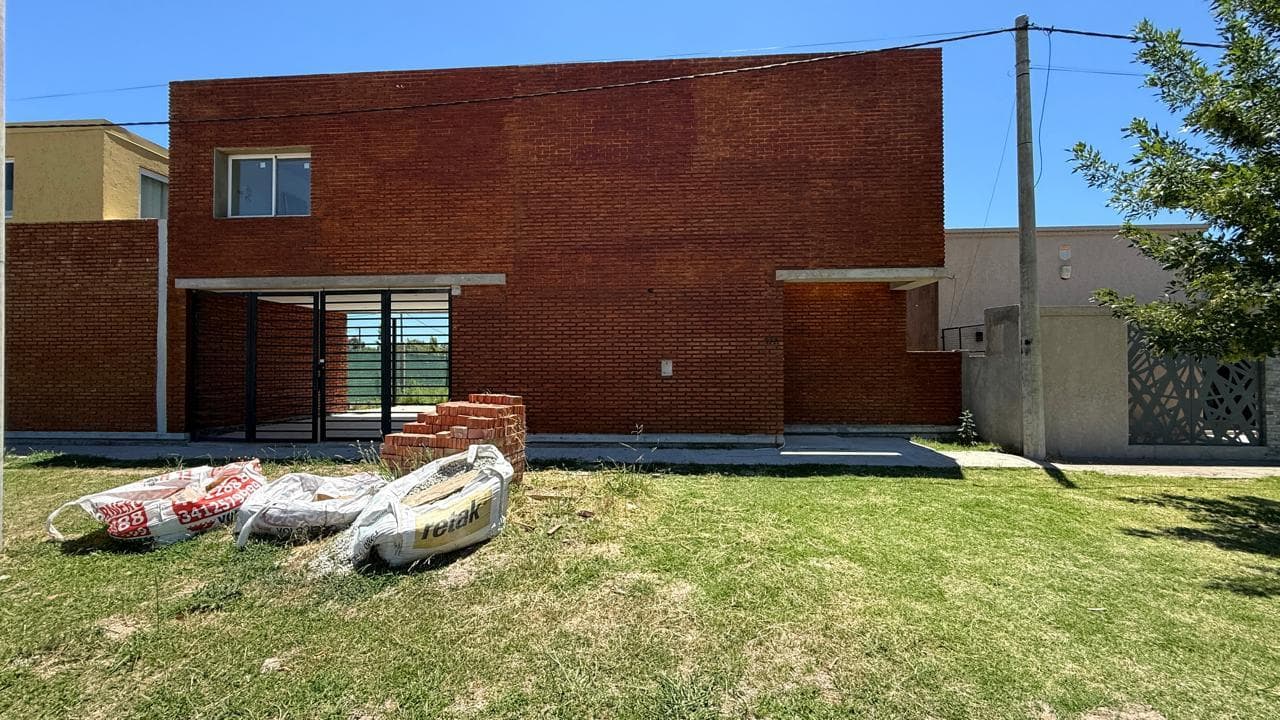 For Sale/Financing Available: Two-Bedroom House with Garage, Barbecue Area, and Garden. Ibarlucea