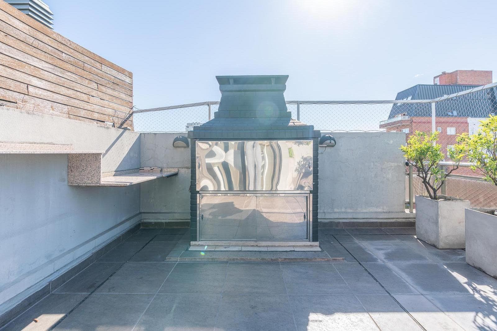 Modern 4-room apartment with a garage. Front patio and balcony terrace.