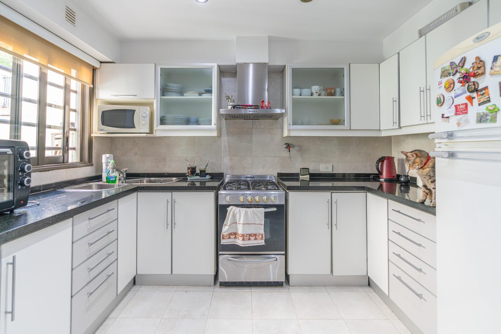 Modern 4-room apartment with a garage. Front patio and balcony terrace.