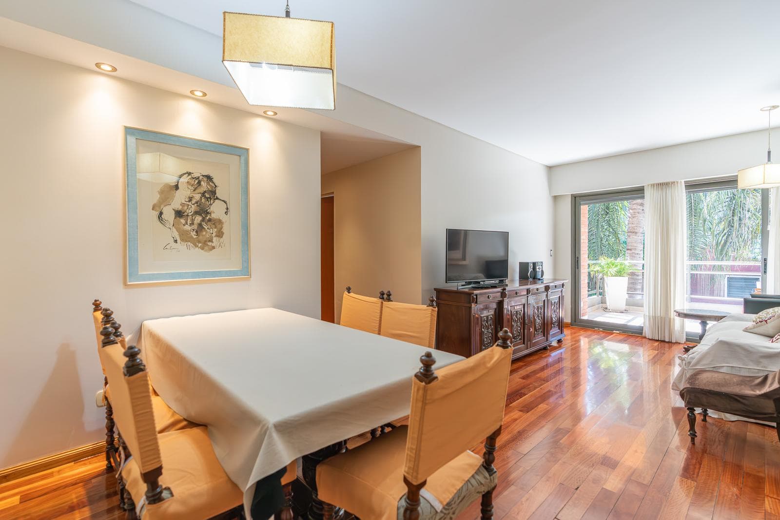 Modern 4-room apartment with a garage. Front patio and balcony terrace.