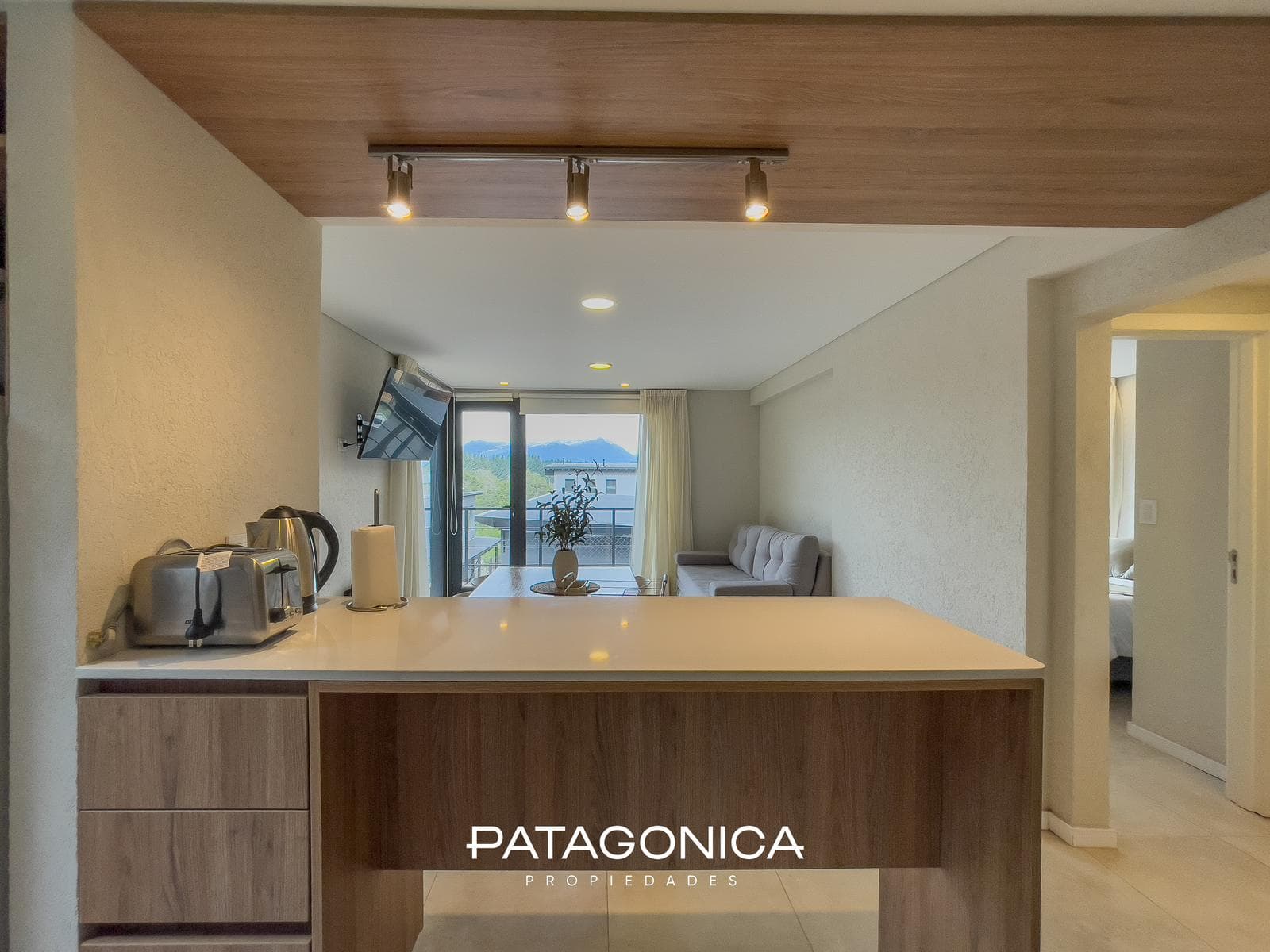 FOR SALE—2-ROOM APARTMENT WITH COVERED PARKING SPACE, DECK, AND GARDEN. EL MERCADO NEIGHBORHOOD, VILLA LA ANGOSTURA