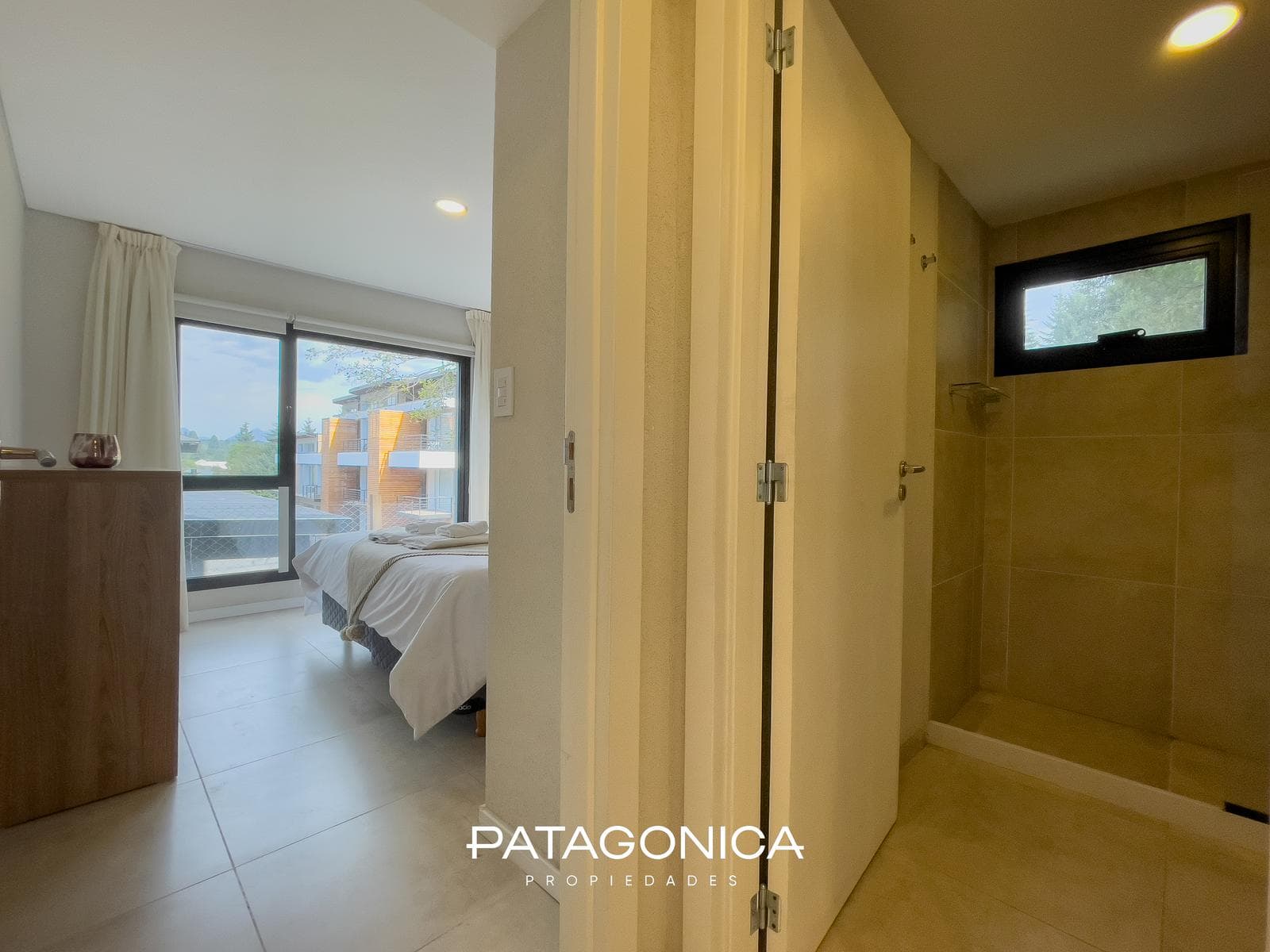 FOR SALE—2-ROOM APARTMENT WITH COVERED PARKING SPACE, DECK, AND GARDEN. EL MERCADO NEIGHBORHOOD, VILLA LA ANGOSTURA