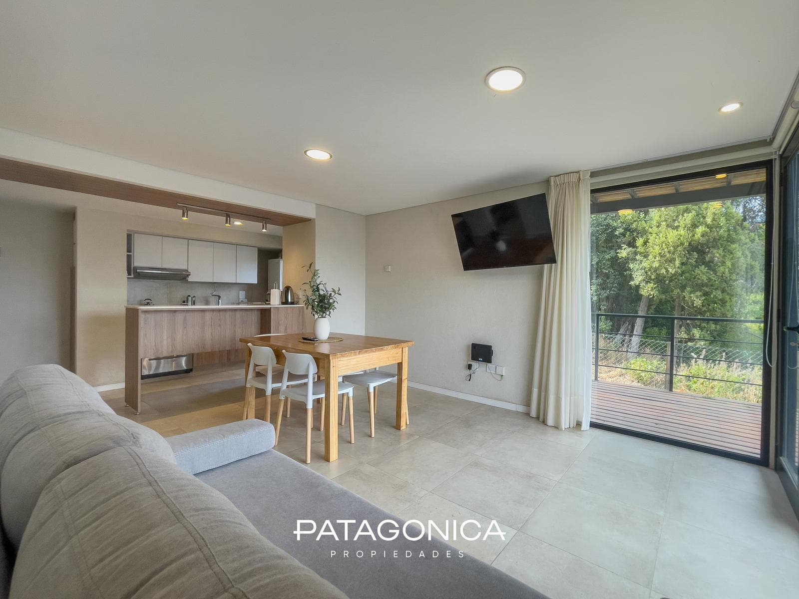FOR SALE—2-ROOM APARTMENT WITH COVERED PARKING SPACE, DECK, AND GARDEN. EL MERCADO NEIGHBORHOOD, VILLA LA ANGOSTURA