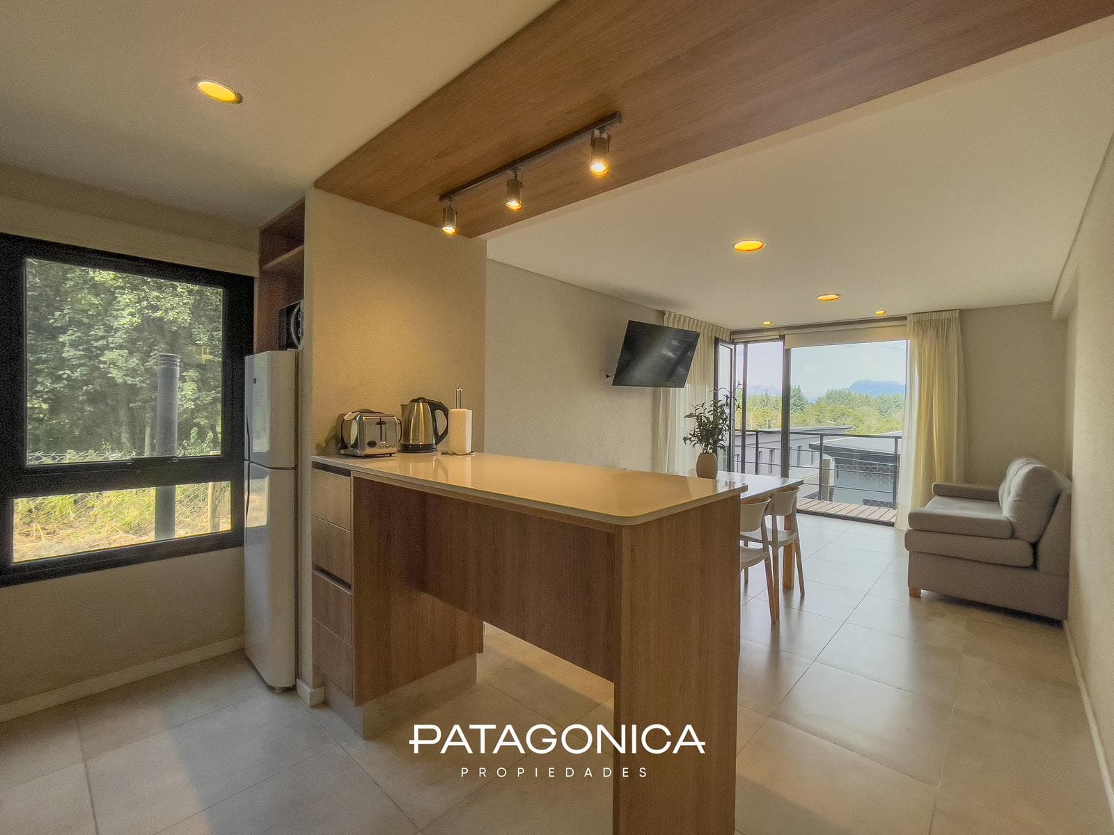 FOR SALE—2-ROOM APARTMENT WITH COVERED PARKING SPACE, DECK, AND GARDEN. EL MERCADO NEIGHBORHOOD, VILLA LA ANGOSTURA