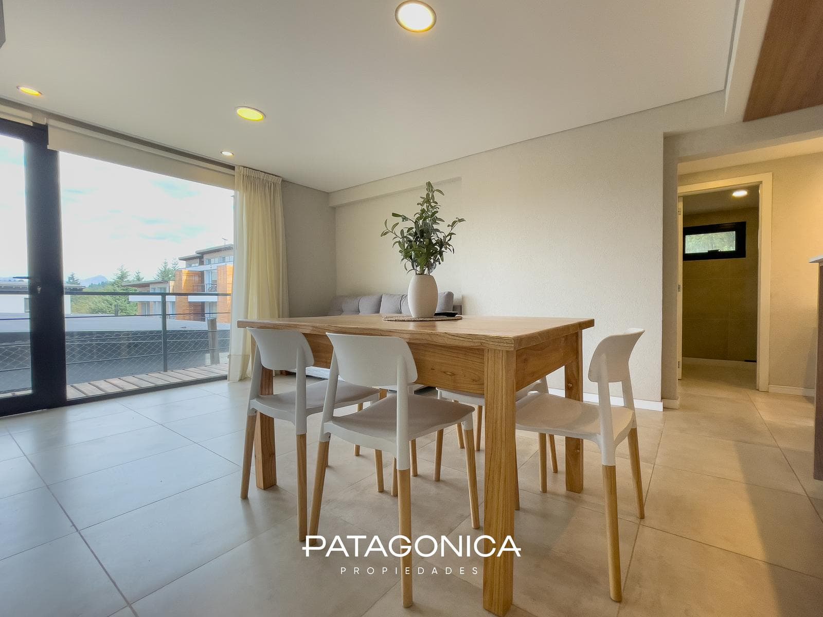 FOR SALE—2-ROOM APARTMENT WITH COVERED PARKING SPACE, DECK, AND GARDEN. EL MERCADO NEIGHBORHOOD, VILLA LA ANGOSTURA