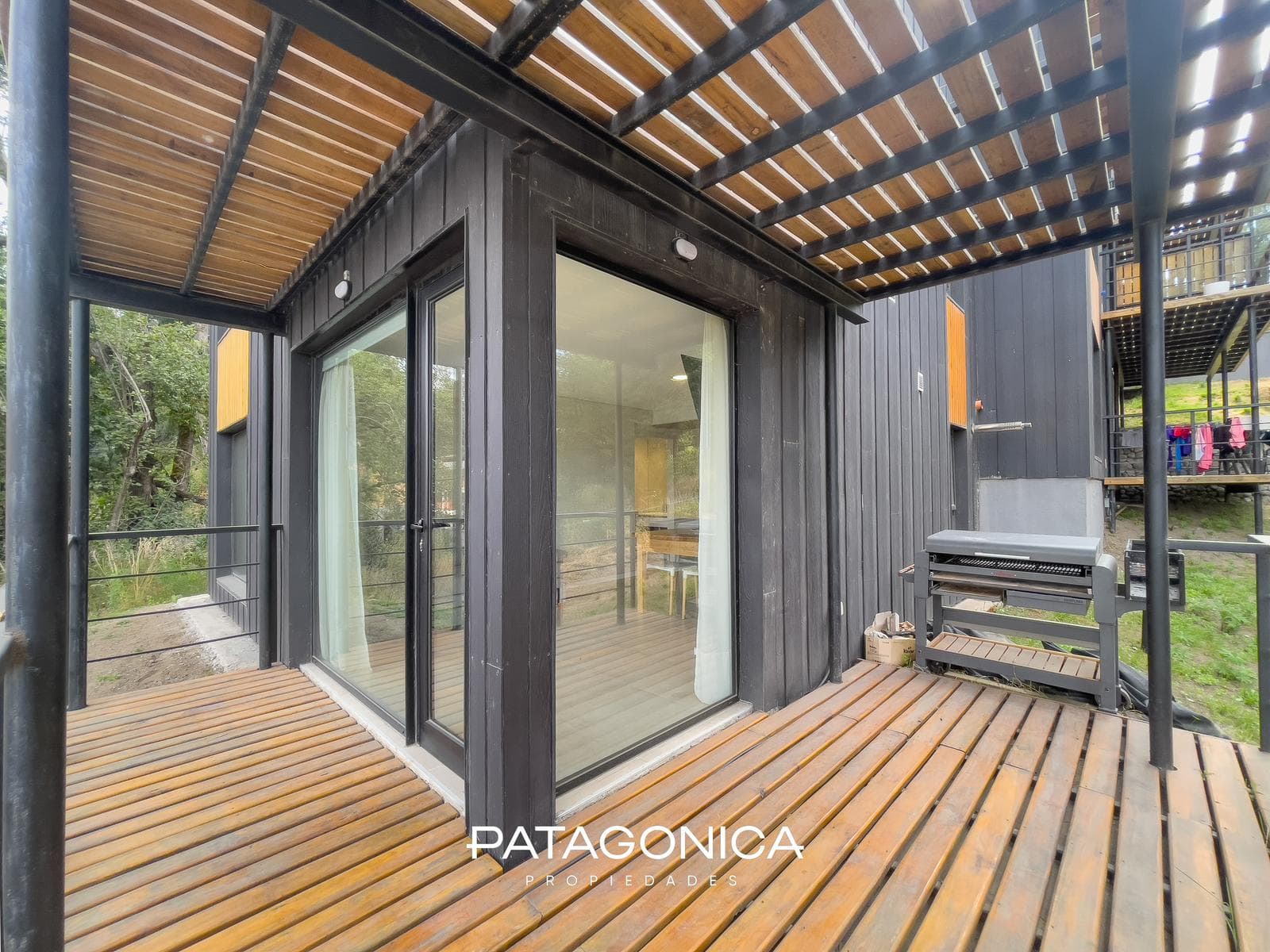 FOR SALE—2-ROOM APARTMENT WITH COVERED PARKING SPACE, DECK, AND GARDEN. EL MERCADO NEIGHBORHOOD, VILLA LA ANGOSTURA