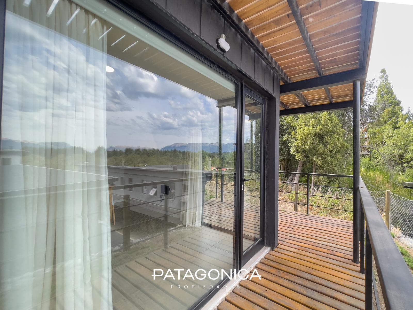 FOR SALE—2-ROOM APARTMENT WITH COVERED PARKING SPACE, DECK, AND GARDEN. EL MERCADO NEIGHBORHOOD, VILLA LA ANGOSTURA